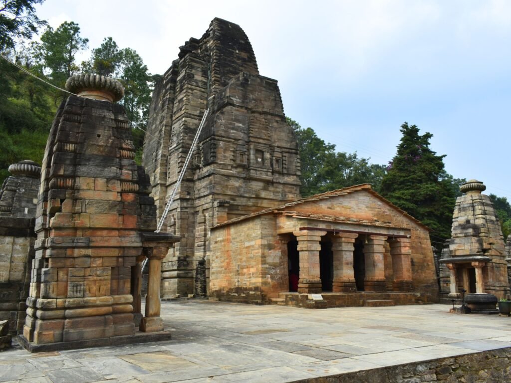 The main stone tower and pillared entryway of the ancient Katarmal Sun Temple.