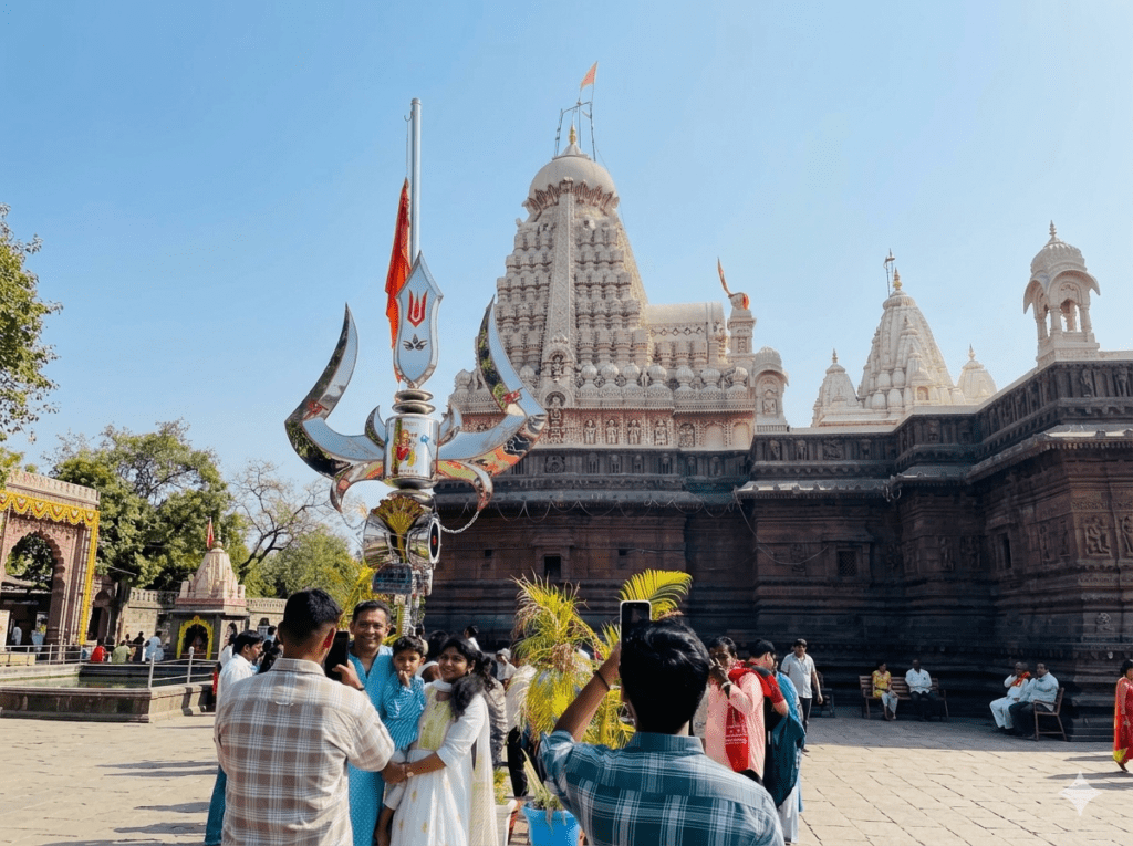 Visitors standing inside the courtyard of Grishneshwar Temple in Maharashtra.