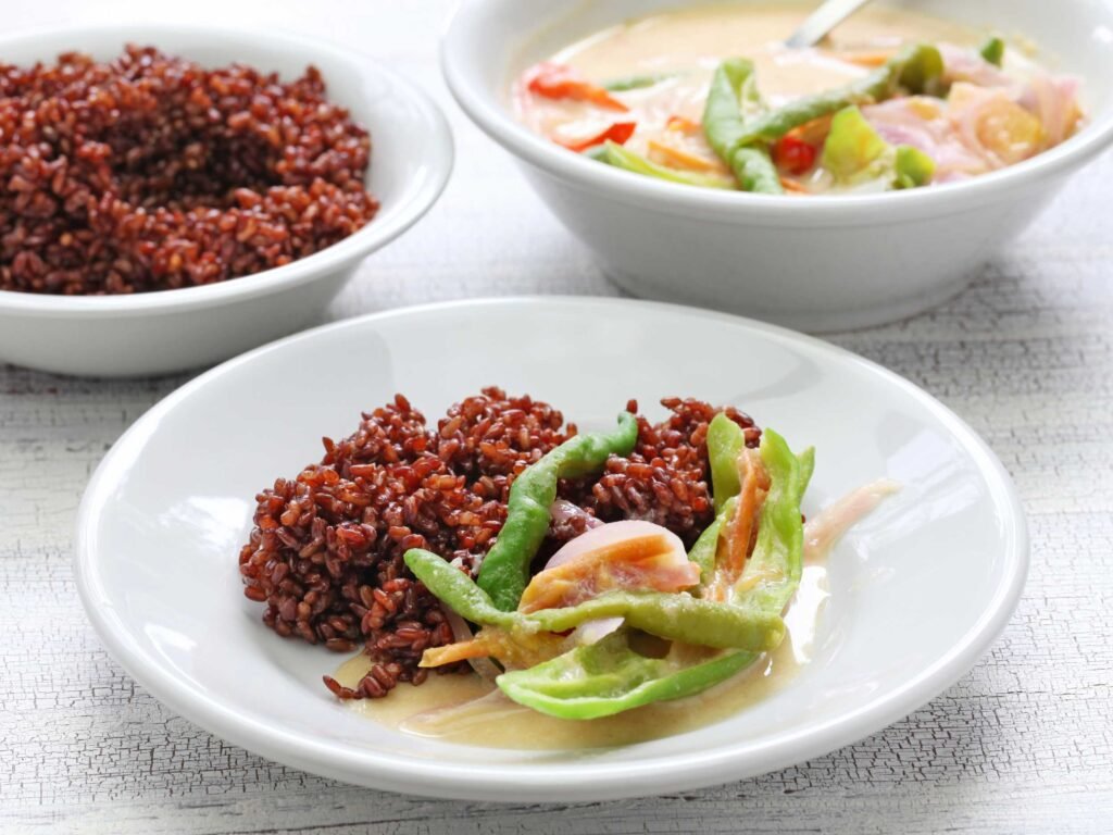 Ema datshi with red rice - One of the culinary things to do in Bhutan