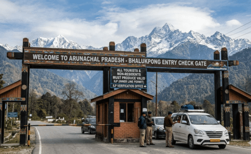Travellers entering Arunachal Pradesh through an Inner Line Permit checkpoint on a mountain road